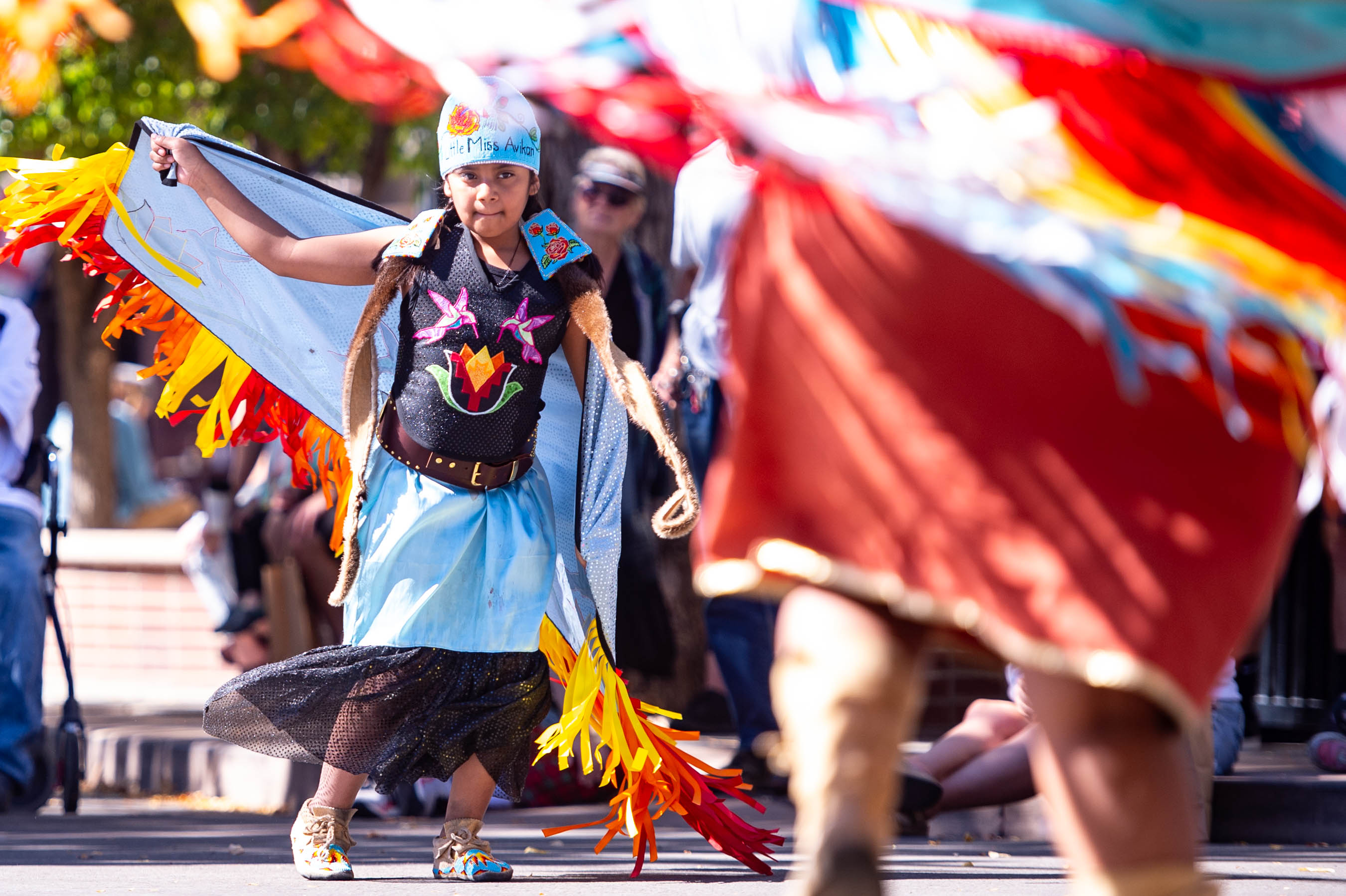 Young girl in traditional Native American dance regalia