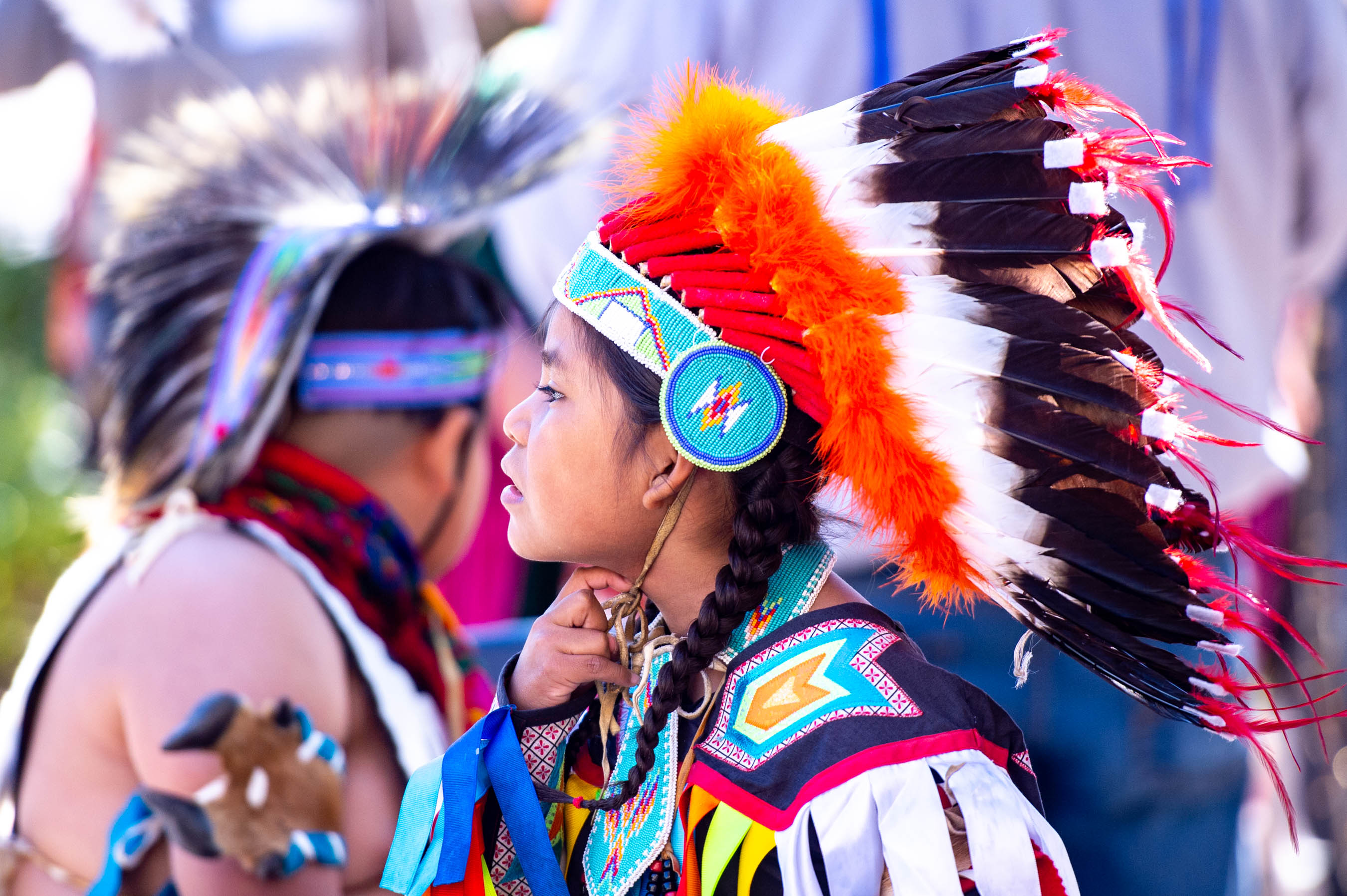 Young Native American dancer in traditional regalia and headdress