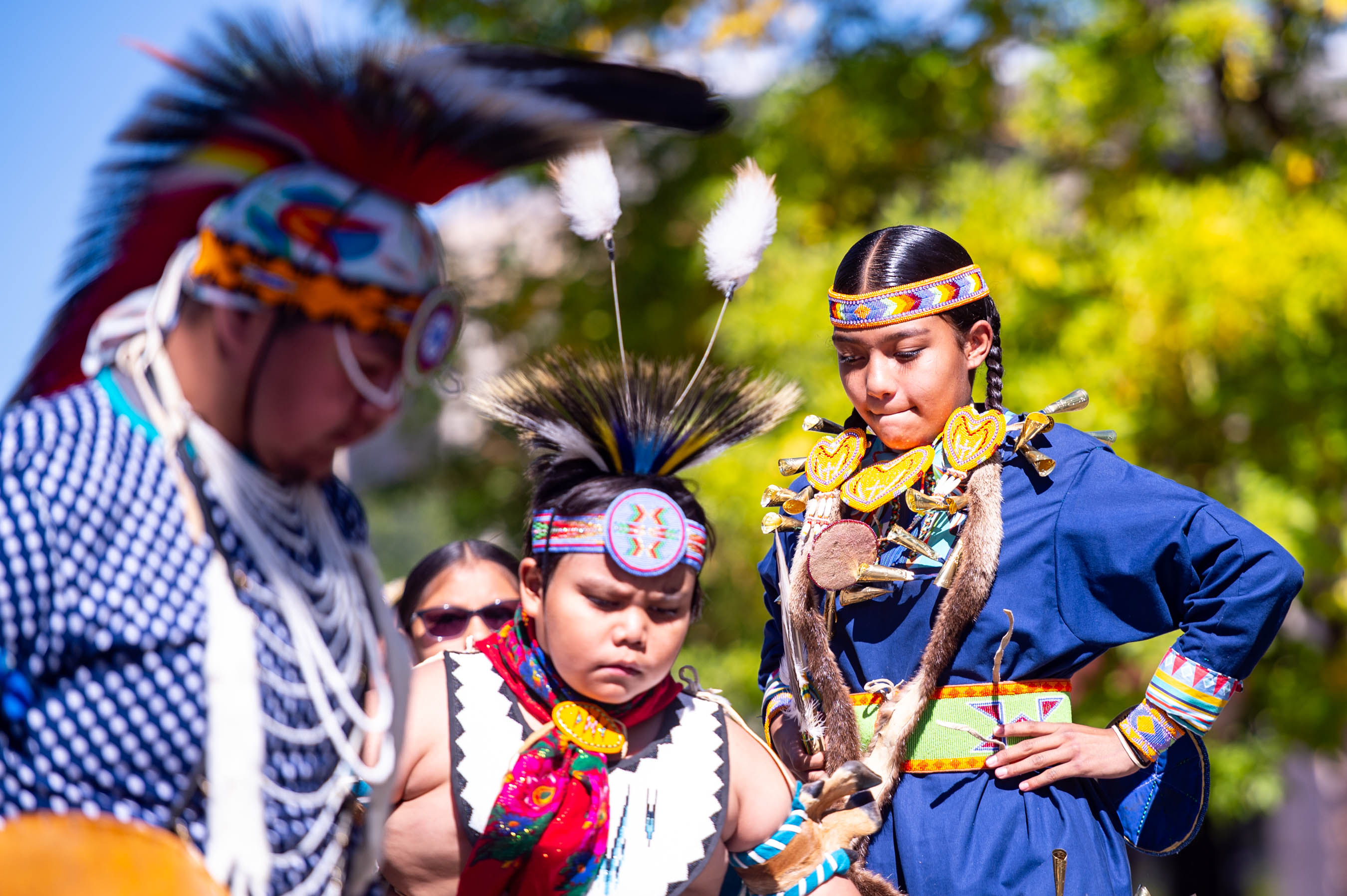 Indigenous dancers in traditional regalia at cultural event