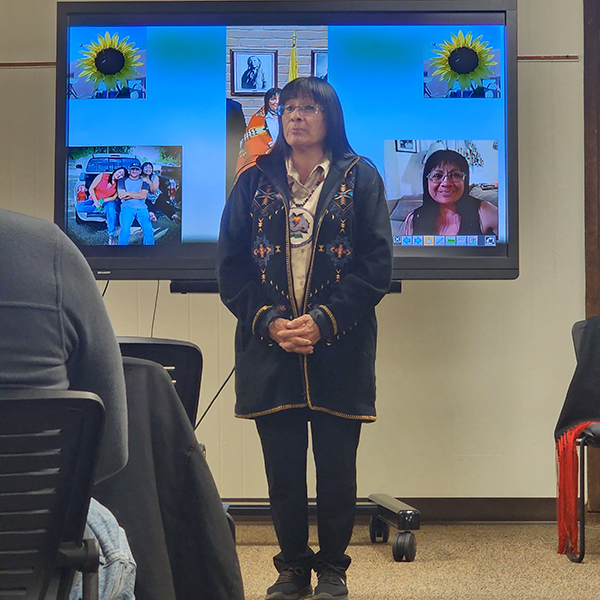 Tina King Washington in front of presentation screen